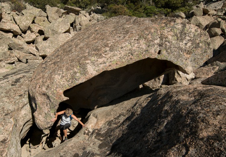 Hiker among granite boulders